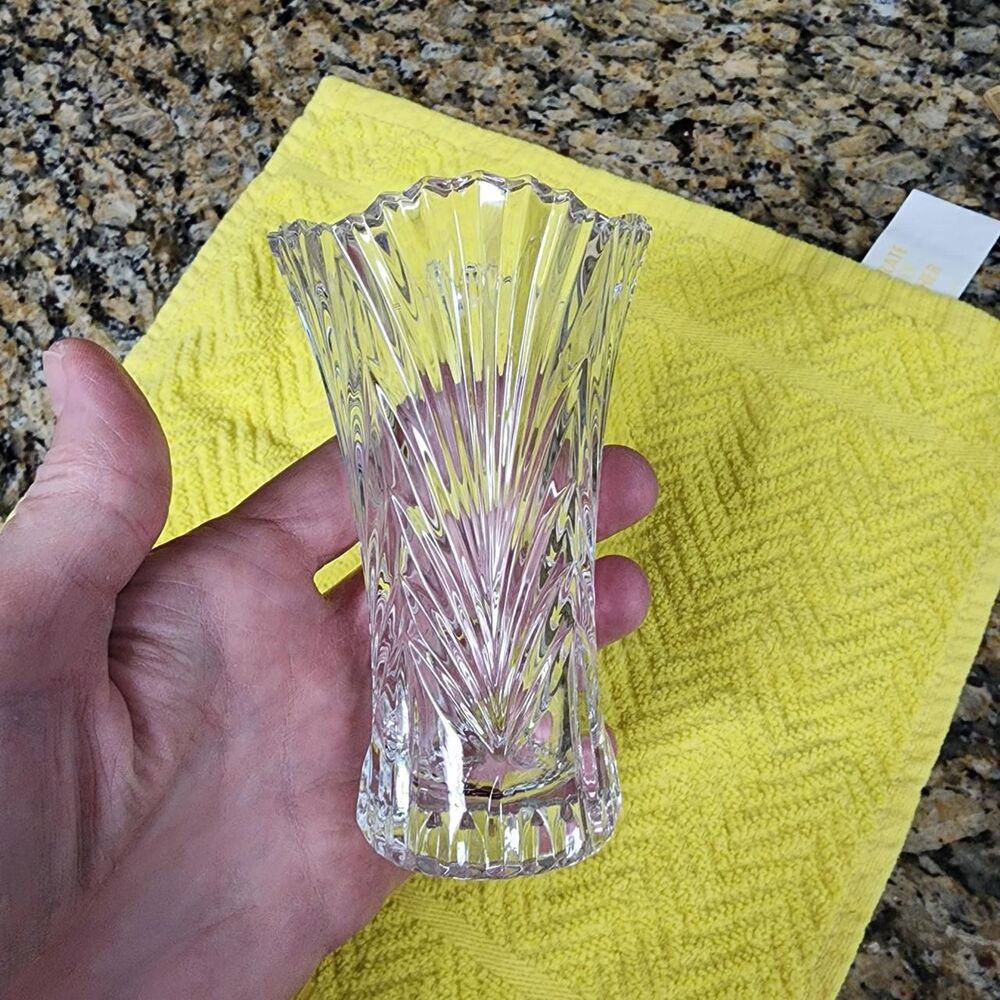 Clear heavy small glass vase approximately 4.75 inches tall